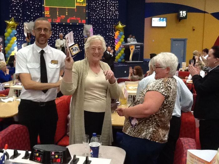 A lucky player celebrates winning at Gala Bingo Maidstone