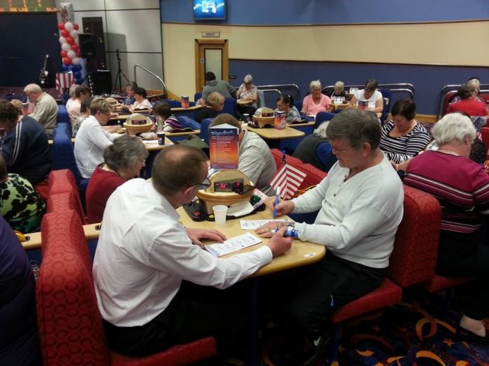 Players concentrating on their bingo cards