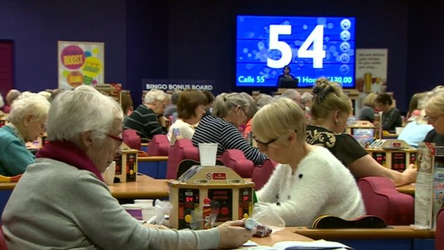 Two bingo players concentrating on their game